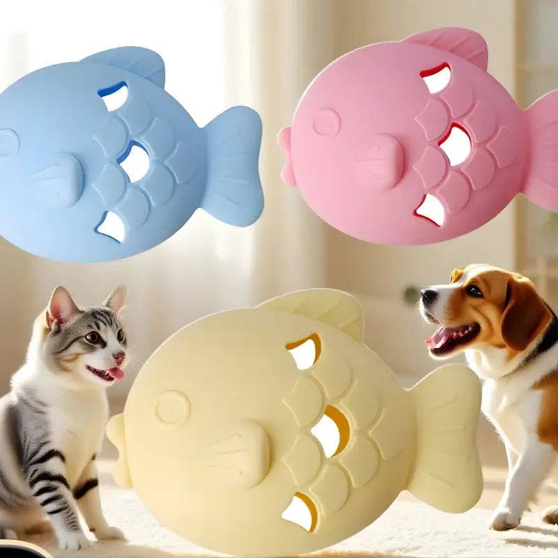 A cat and a dog looking at fish shaped silicone treat dispenser toys in light yellow, blue and pink