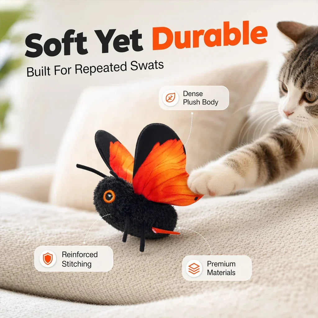 Cat paw reaching for the flapping butterfly cat toy on a sofa, captioned soft yet durable with dense plush body, reinforced stitching and premium materials.