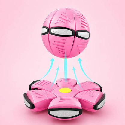 Macaron pink flying saucer ball dog toy shown as a ball above its flattened disc form.