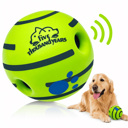 Green giggle ball dog toy with sound holes and a golden retriever lying beside it