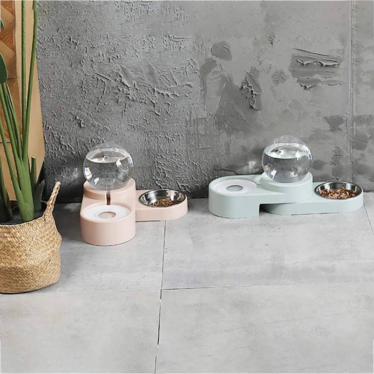 The gravity water dispenser and food bowl set in both colors, light blue and pink, side by side on a tiled floor