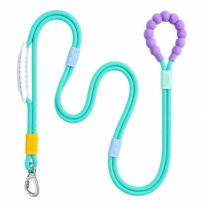 The green Noblias hands free dog leash laid out, showing the silicone beaded loop handle and the metal swivel clip.