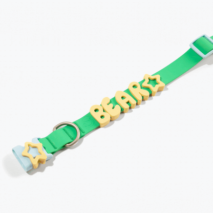 Green and yellow waterproof dog collar with customizable name charms from Noblias, featuring secure buckle and reflective accents.