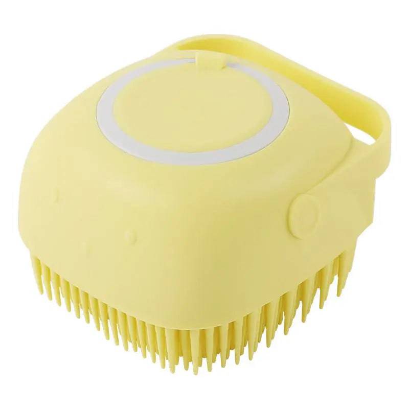 Yellow Noblias handheld silicone dog bath brush with its shampoo lid and loop handle.