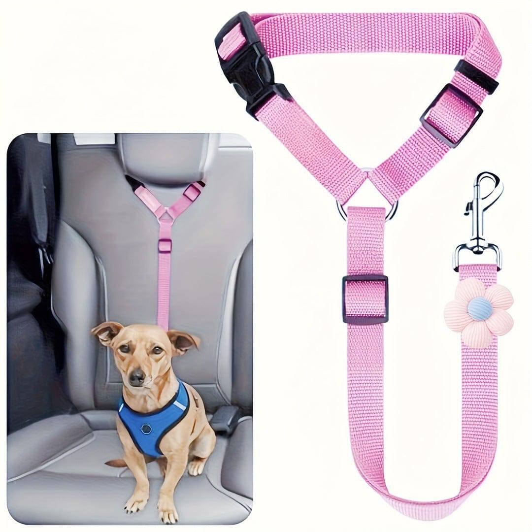 Pink headrest dog seat belt on a harnessed dog in the back seat, with the strap shown beside it