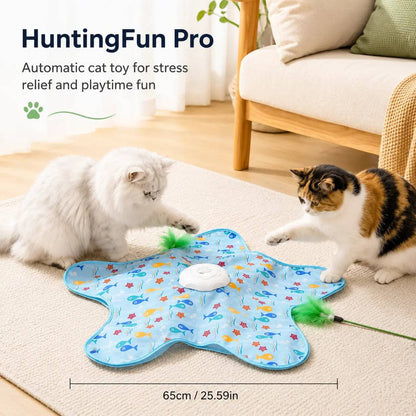 Blue hide and seek cat toy mat in a living room with two cats playing on it, with a scale bar marking the mat at 65 cm or 25.59 inches across