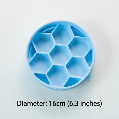 Top view of the empty blue Noblias honeycomb slow feeder dog bowl, showing the raised hexagonal walls that divide it into separate cells.