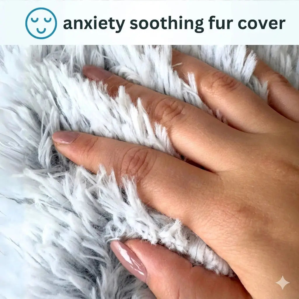 Hand pressing into the long soft plush fur of the Noblias calming hooded cave pet bed.