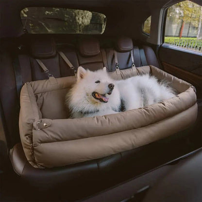 A samoyed lying in the cream Noblias large dog car seat bed on the back seat.