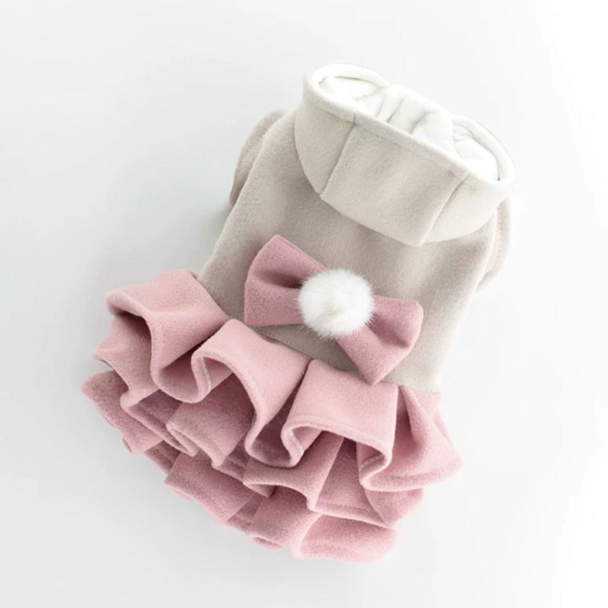 Pink layered dog dress laid flat showing the tiered ruffle skirt
