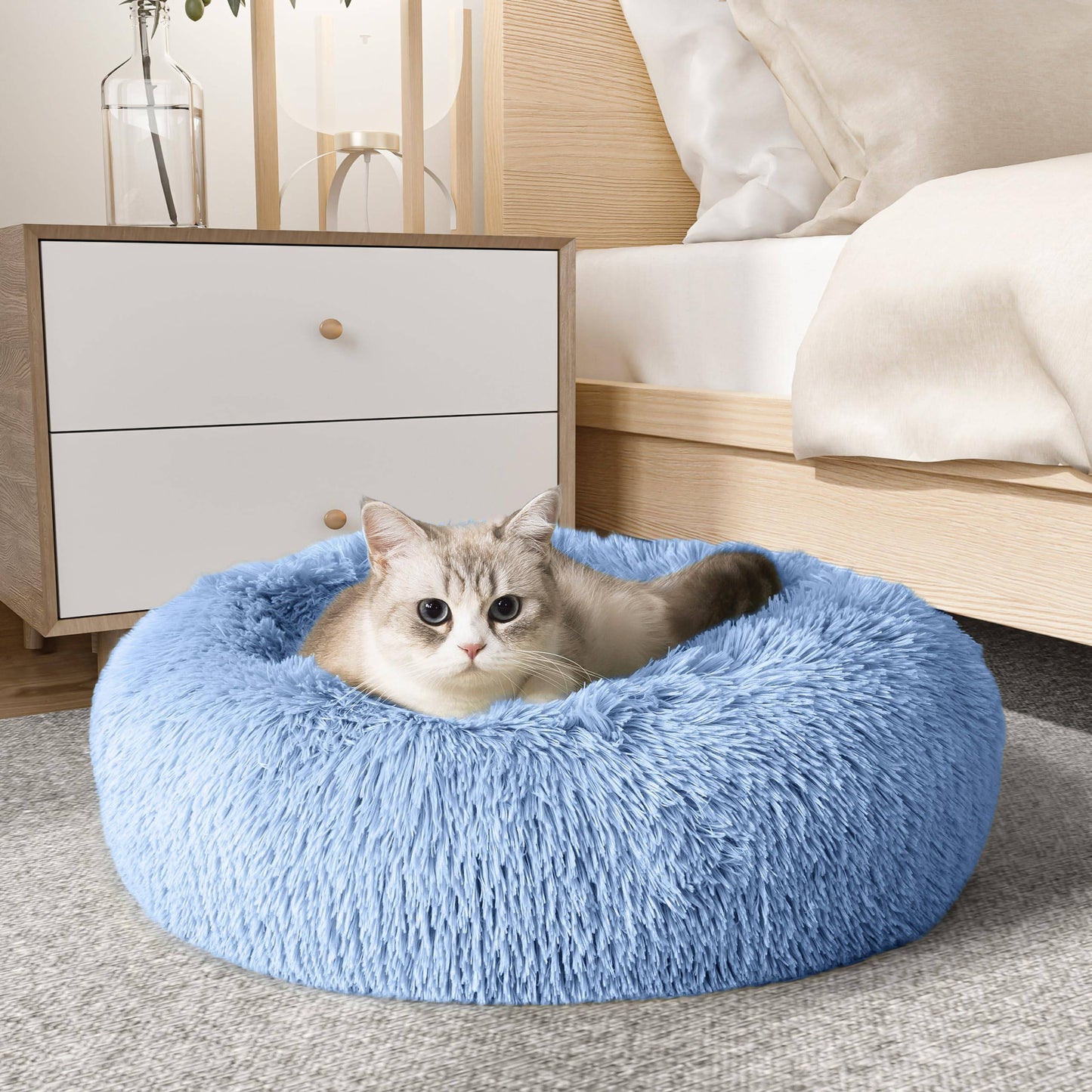 Light grey Noblias Cloud Calming Donut Dog and Cat Bed, small size with soft, plush, rounded design for cozy comfort.