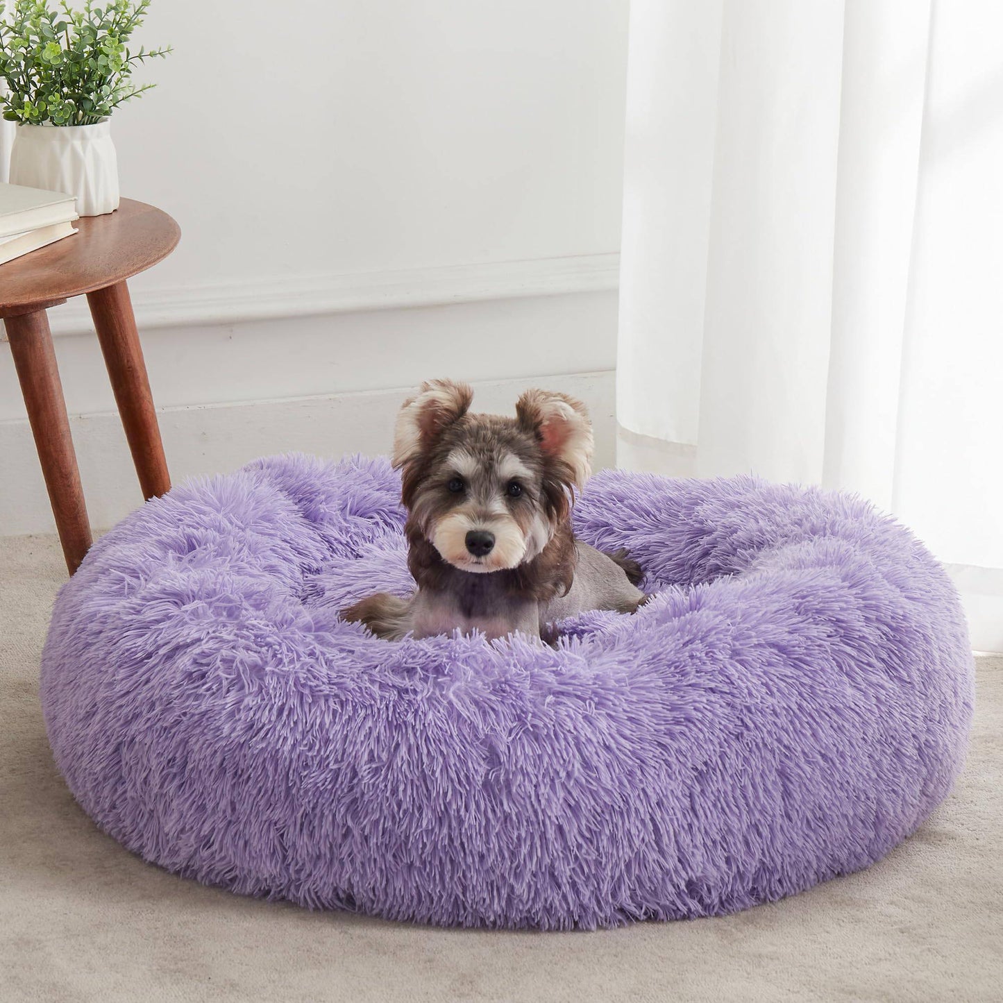 Light grey Noblias Cloud Calming Donut Bed for small dogs and cats, plush round pet bed with soft, cozy interior.