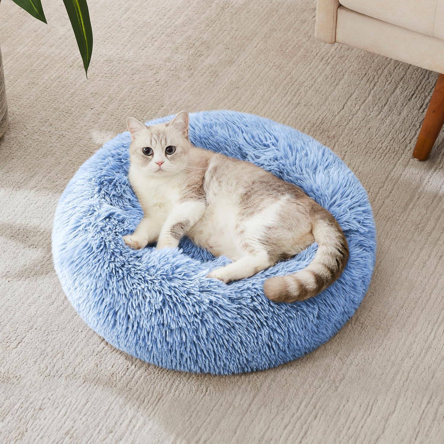 Light grey Noblias Cloud Calming Donut Bed for small dogs and cats, soft, plush, and cozy pet resting spot.