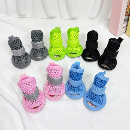 All five colors of the Noblias mesh dog sandals laid out together: gray, green, black, pink and blue.