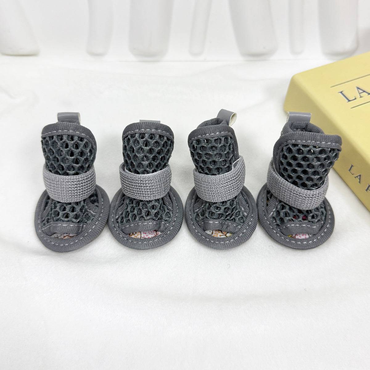 Set of four gray Noblias mesh dog sandals with wide open toes and grippy soles.