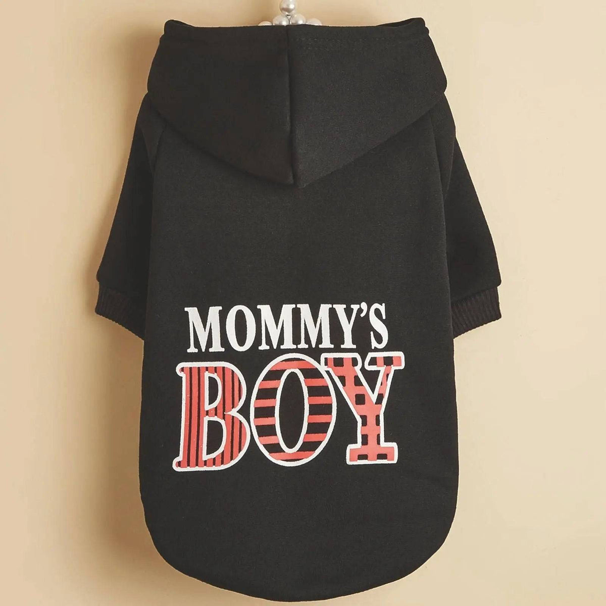 The black Noblias Mommy's Boy dog hoodie shown on a hanger, with the hood and the striped print across the back.