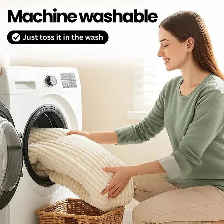 Woman loading the cream ribbed plush cover into a washing machine, headed Machine Washable.