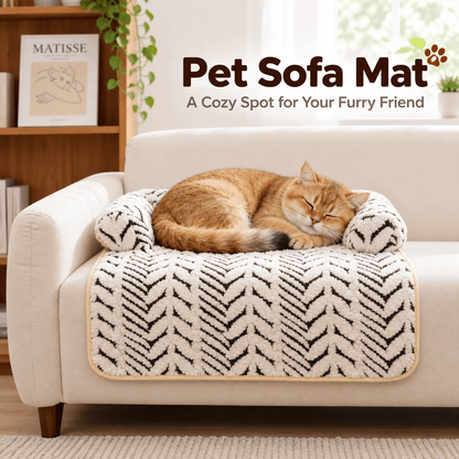 Ginger cat sleeping on the pet couch cover bed with its front panel draped over a white sofa seat.