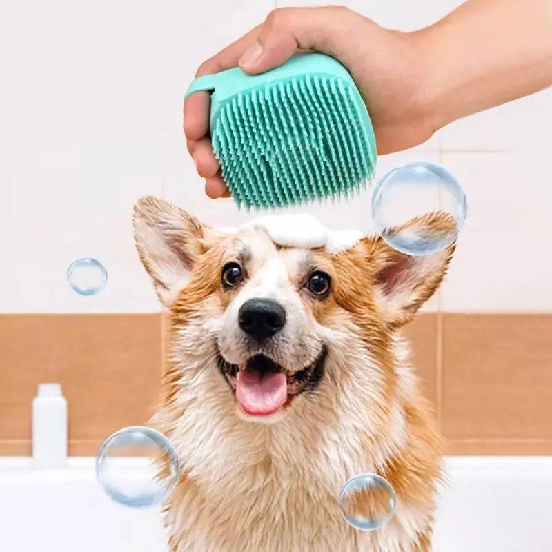 Teal silicone shampoo bath brush lathering the head of a wet corgi in a bathtub.