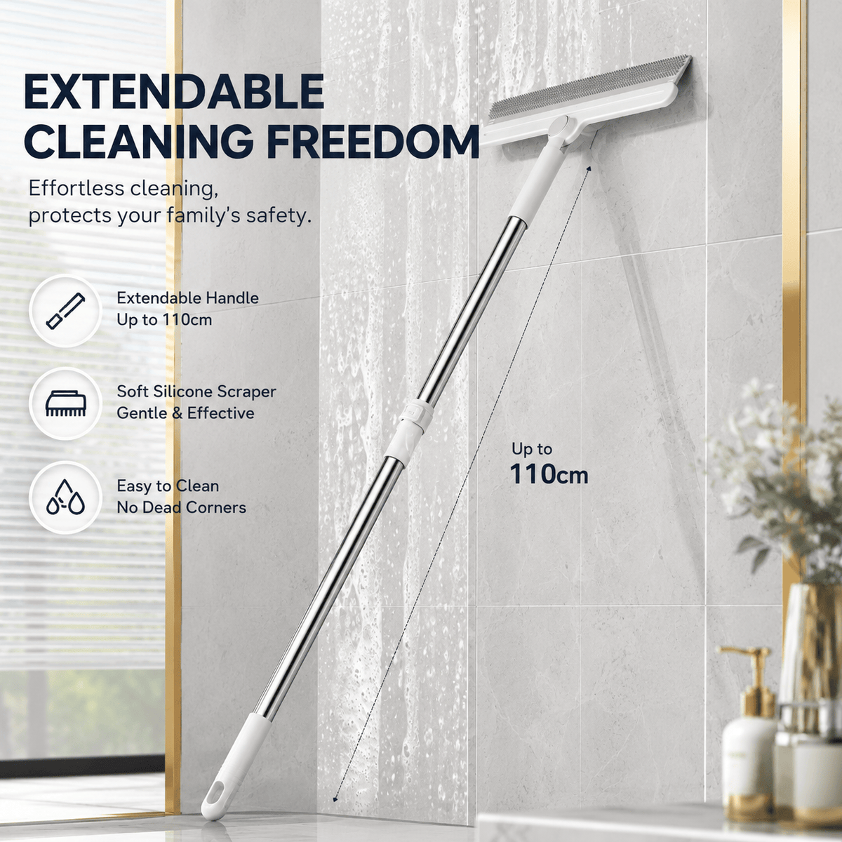 Pet hair removal broom with its telescopic handle extended to 110 cm against a bathroom wall, with extendable handle, soft silicone scraper and easy to clean callouts.