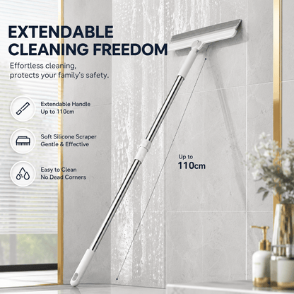 Pet hair removal broom with its telescopic handle extended to 110 cm against a bathroom wall, with extendable handle, soft silicone scraper and easy to clean callouts.
