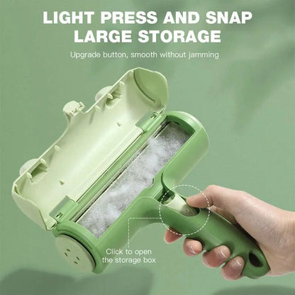 Hand holding the green pet hair remover brush with the storage box open and full of collected fur, and the click-to-open button marked.