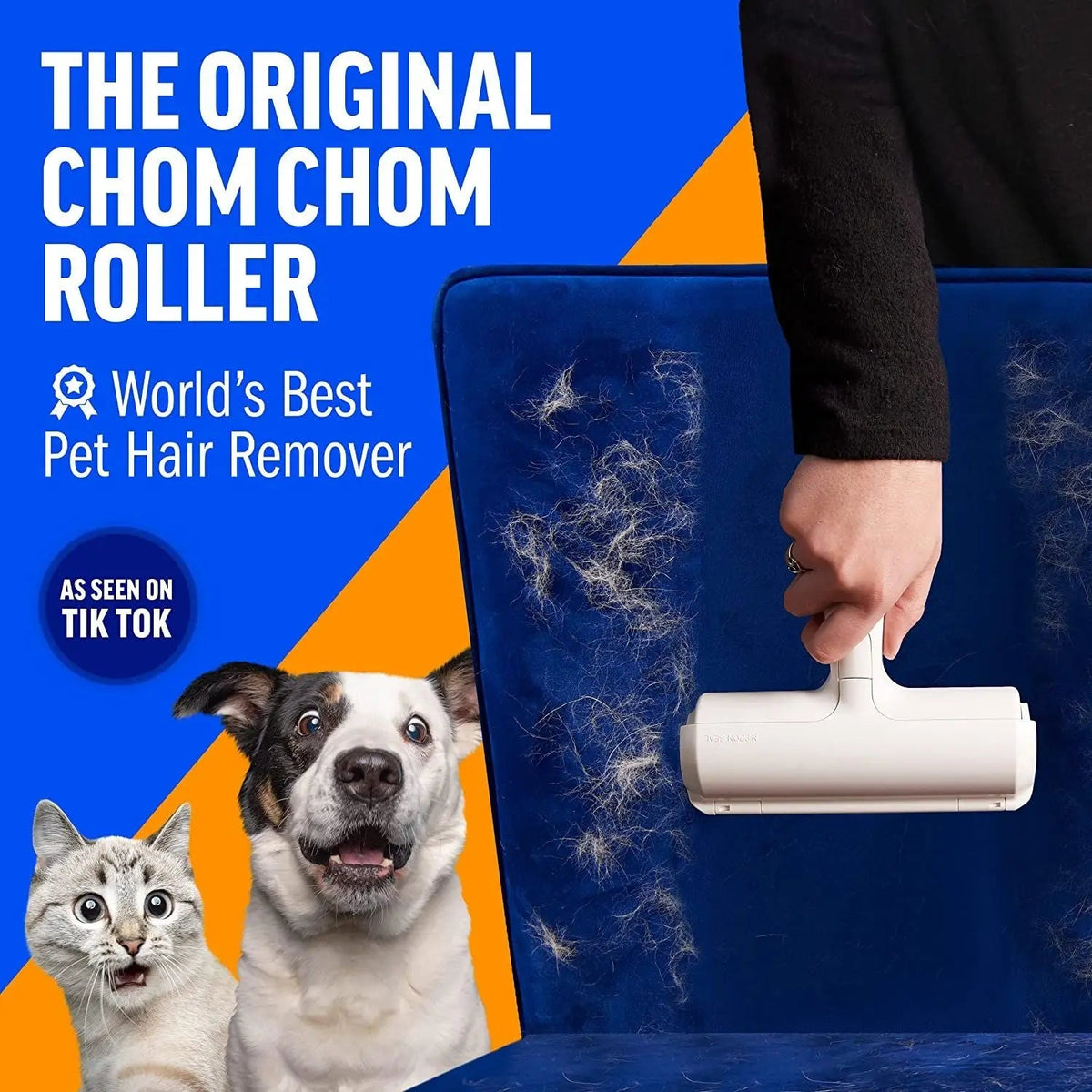 Hand rolling the white pet hair remover roller across a fur-covered blue velvet cushion, with a dog and a cat looking on.