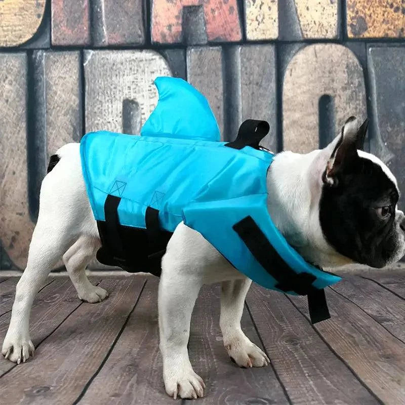 Blue Noblias dog swim vest with shark design, XS size, provides safe swimming support for pets in water.