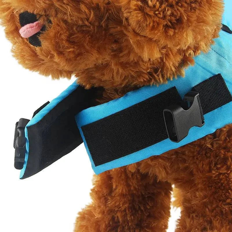 Blue Noblias dog swim vest with shark design, XS size, pet life jacket for safe swimming and water safety.