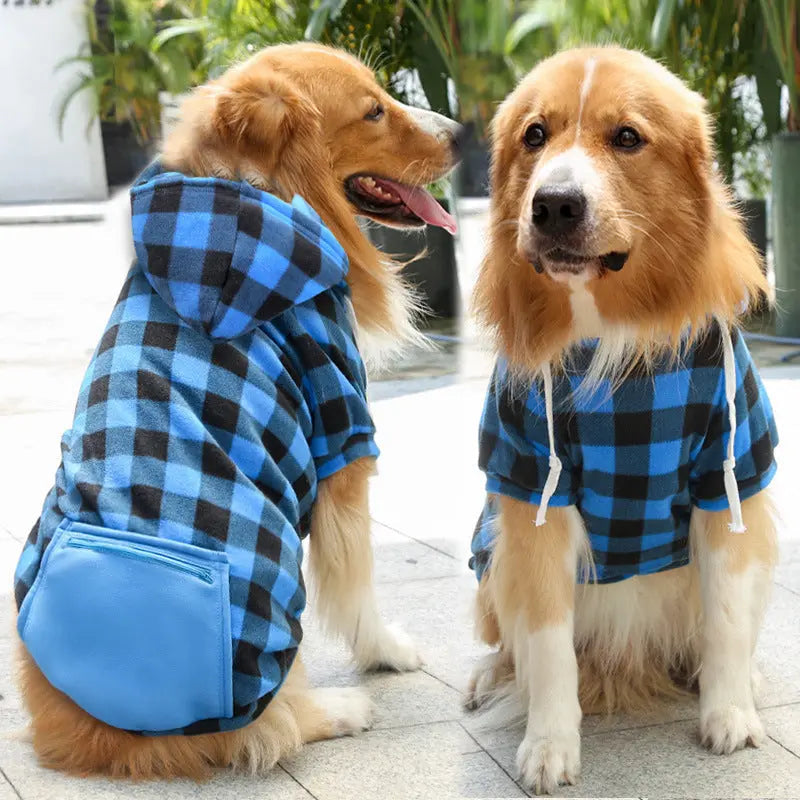 Two golden retrievers wearing the blue and black plaid fleece dog hoodie with a blue zip pocket.