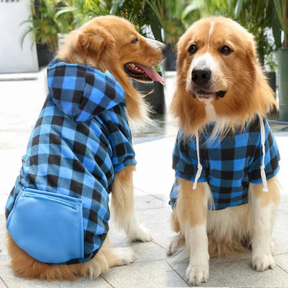 Two golden retrievers wearing the blue and black plaid fleece dog hoodie with a blue zip pocket.