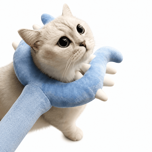 A cream colored cat with the blue U shaped plush head resting around its neck and one paw on the handle.