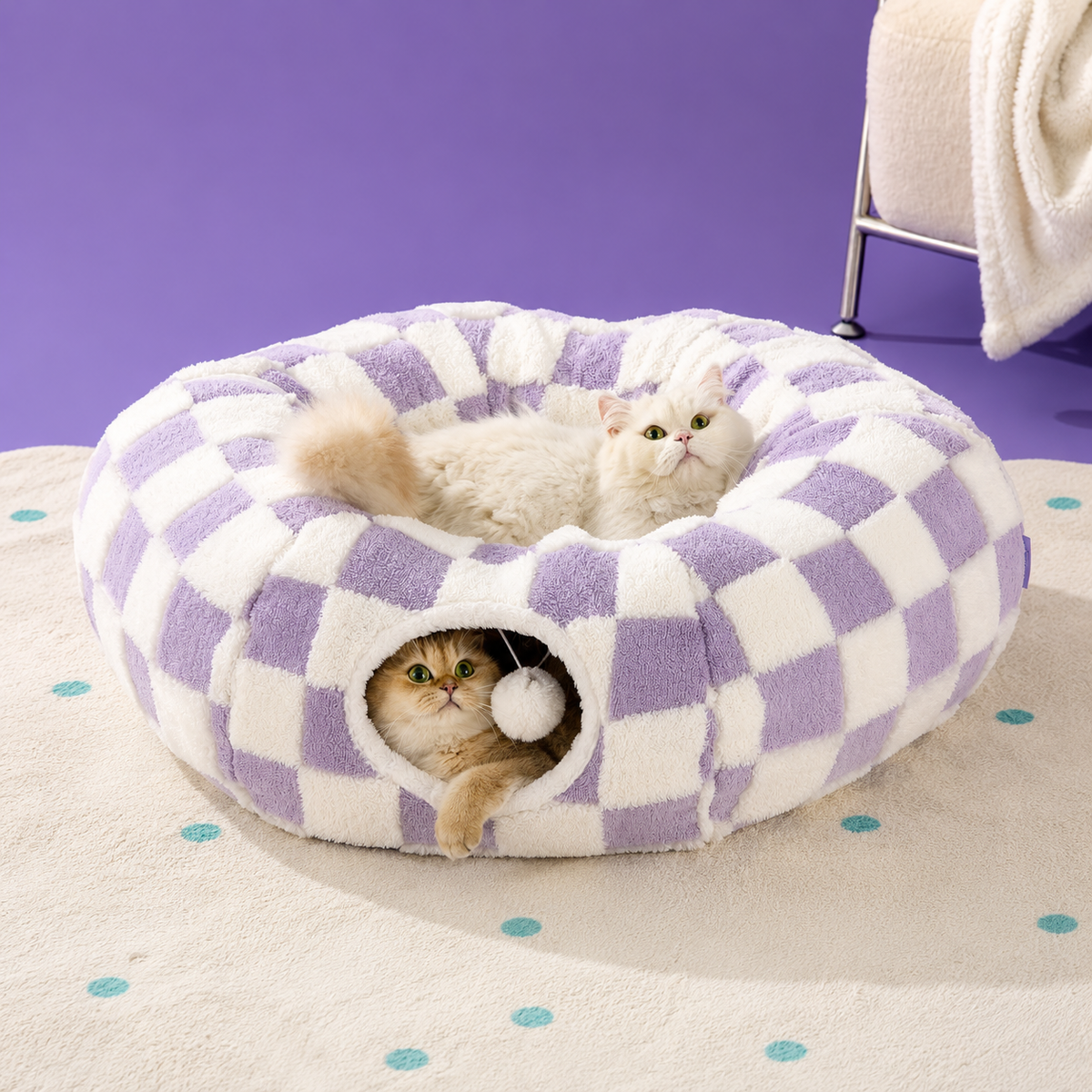 Purple checkerboard plush cat tunnel bed with two cats resting on the padded ring