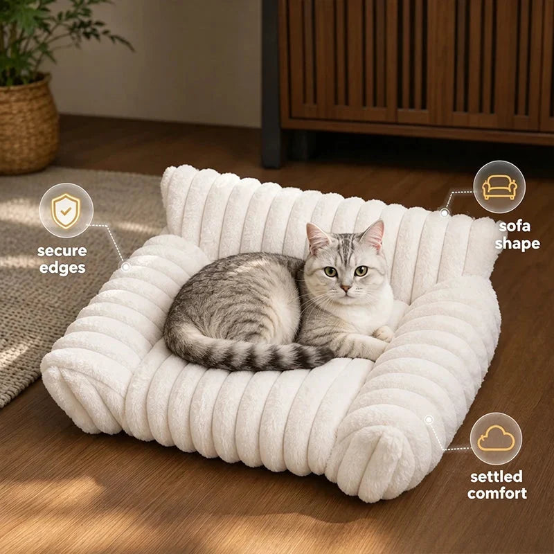 A gray and white cat sitting in a cream sofa bed with labels pointing to the secure edges and the sofa shape.