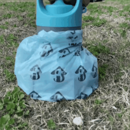 Animation of the portable claw pooper scooper picking up dog waste from the ground with a bag.