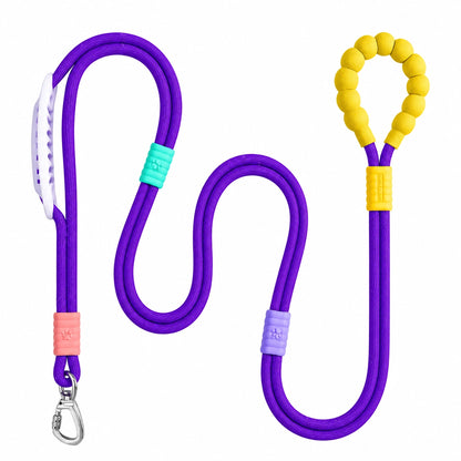 The purple Noblias hands free dog leash laid out, showing the silicone beaded loop handle and the metal swivel clip.