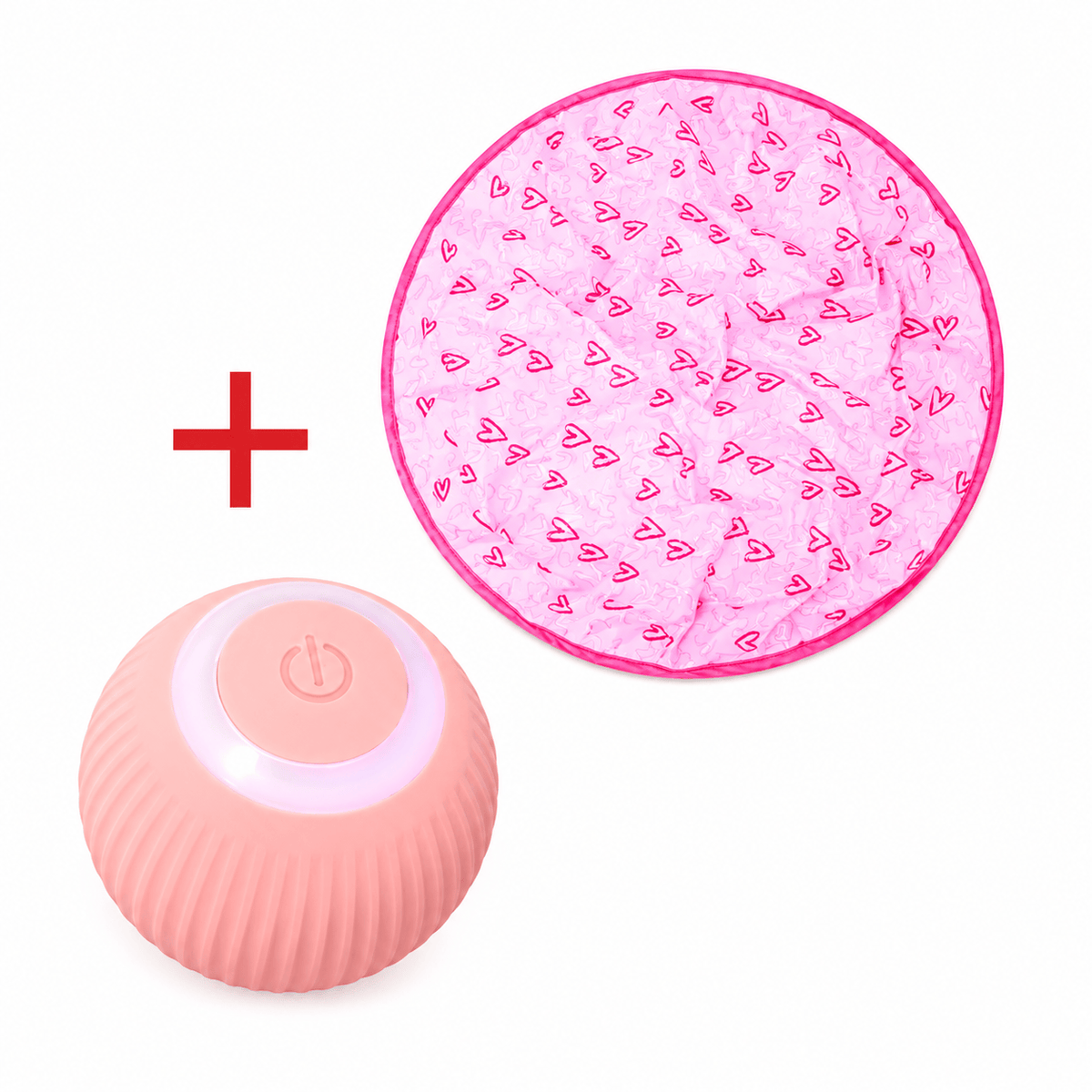 Pink heart print play mat beside the coral rolling ball with its power button.