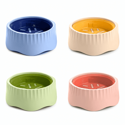 Rotatable slow feeder bowls in blue, yellow, green and pink inserts on cream bodies.