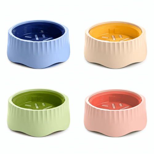 Rotatable slow feeder bowls in blue, yellow, green and pink inserts on cream bodies.