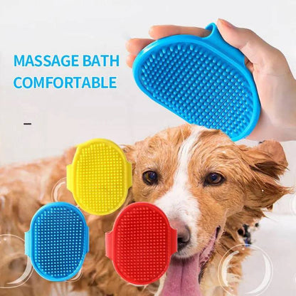 Hand holding the blue rubber pet bath brush over a wet dog in the tub, with the red, yellow and blue brushes shown alongside.