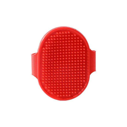 Red oval rubber pet bath brush with its molded hand strap, shown face on against a white background.