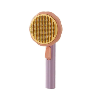 Purple self cleaning cat slicker brush with a yellow head on a white background.