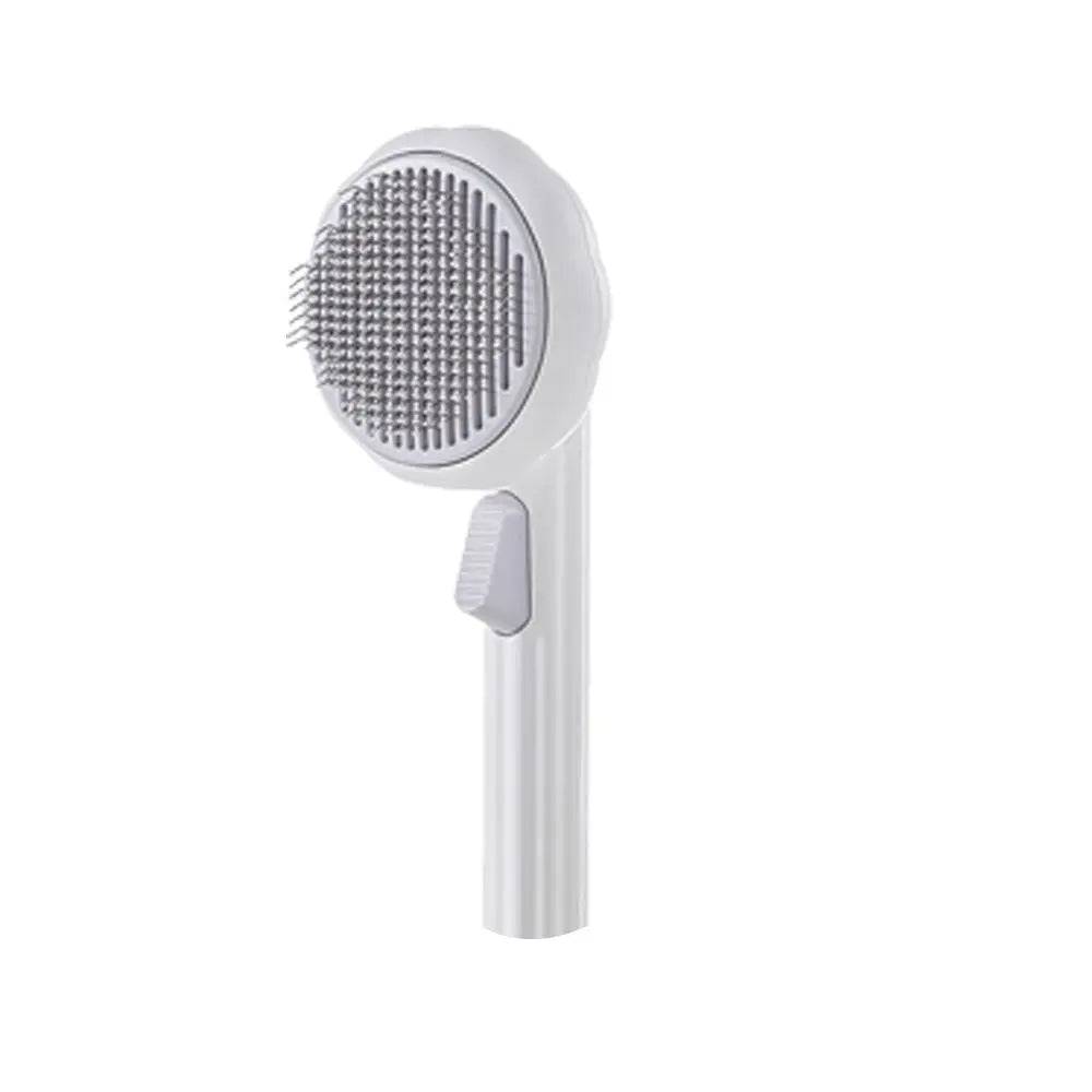White self cleaning cat slicker brush with a gray head on a white background.