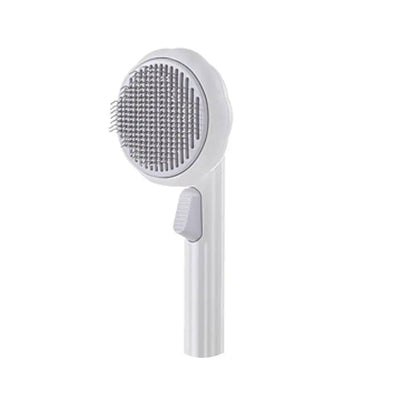 White self cleaning cat slicker brush with a gray head on a white background.