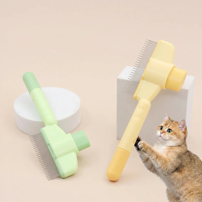 Yellow and green self cleaning cat slicker brushes standing on a beige backdrop with a kitten reaching up.