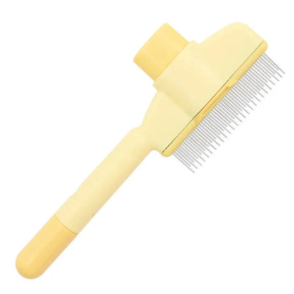 Yellow self cleaning cat slicker brush with rounded tip pins on a white background.