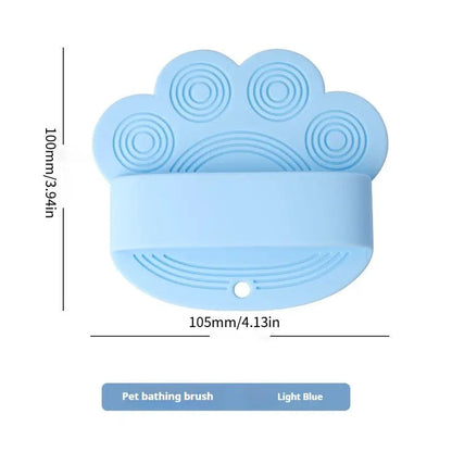 Light blue silicone dog bath brush with its 105 mm width and 100 mm height marked.