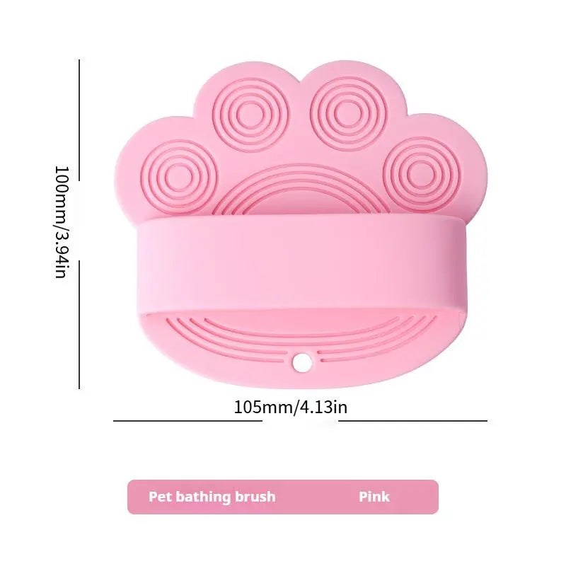 Pink silicone dog bath brush with its 105 mm width and 100 mm height marked.