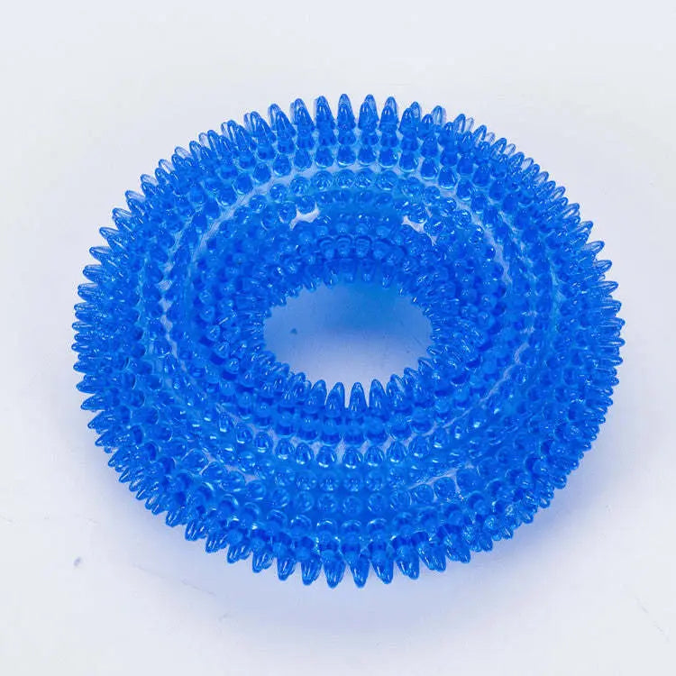 Blue spiky dog chew ring on a white background.