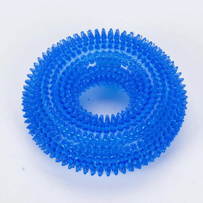 Blue spiky dog chew ring on a white background.